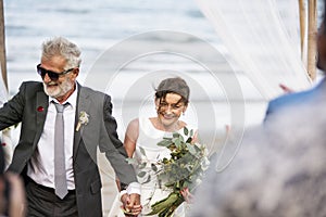 Mature couple getting married at the beach