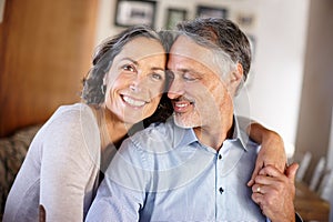 Mature couple, happy and hug in home for portrait with bonding, care and together with love in living room. Senior