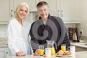 Mature couple having breakfast together