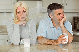 Mature couple having coffee together not talking