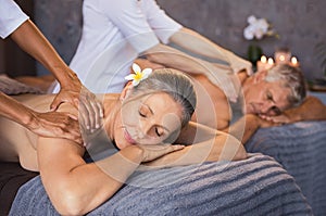 Mature couple having massage at spa