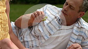 Mature couple having a picnic together