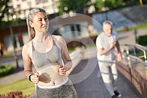 A mature couple having their morning jogging in the park