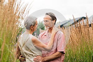 Mature couple hugging each other while standing