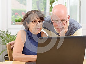 Mature couple with a laptop