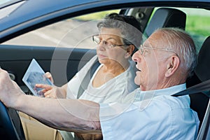 Mature couple lost inside car