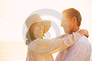 Mature Couple in Love on the Beach at Sunset