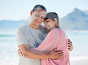 Mature couple, love and hug outdoor at beach with a smile, care and happiness together in nature. A happy man and woman