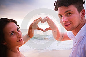 Mature couple with love sign