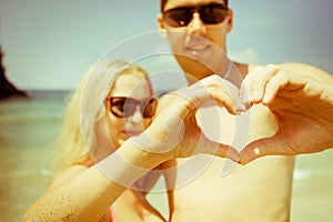 Mature couple with love sign