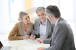 Mature couple meeting banking advisor