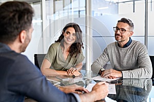 Mature couple meeting financial advisor for investment