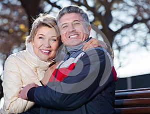 Mature couple on park bench