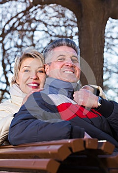 Mature couple on park bench