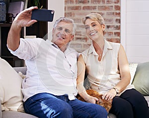 Mature couple, phone and selfie on couch for social media update, profile picture and memory together. Mobile, senior