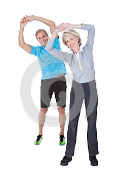 Mature couple on pilates ball