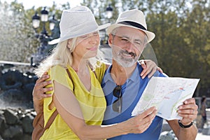 Mature couple reading map