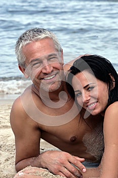 Mature couple relaxing on the beach