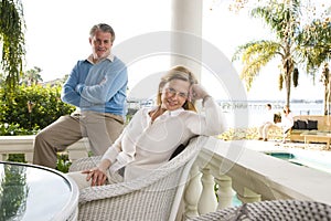 Mature couple relaxing on terrace