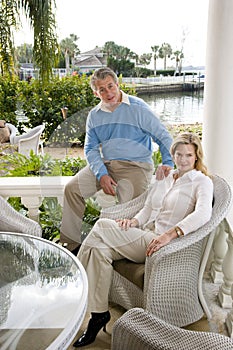 Mature couple relaxing on terrace photo