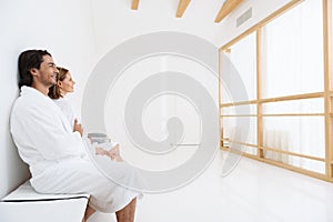 Mature couple relaxing together at day spa