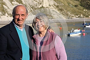 Mature couple seaside setting.