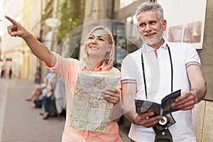 Mature couple sightseeing photo