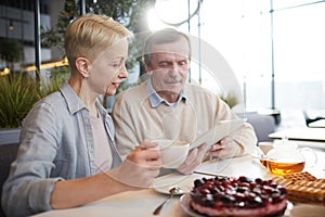 Mature couple sitting in cafe