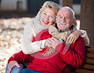 Mature couple sitting in park
