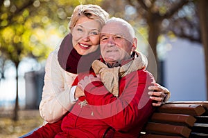 Mature couple sitting in park