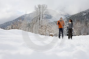 A mature couple skiing photo