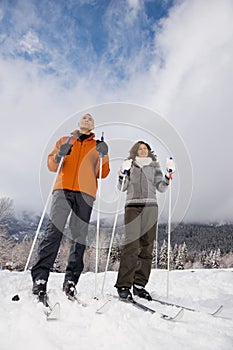 A mature couple skiing