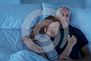 Mature couple sleeping at night