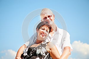 Mature couple smiling and embracing