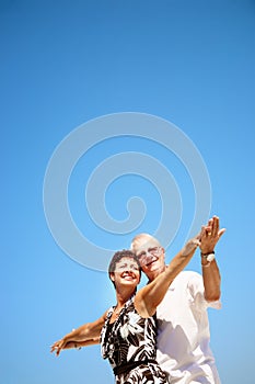 Mature couple smiling and embracing