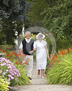 Mature Couple Strolling In Park