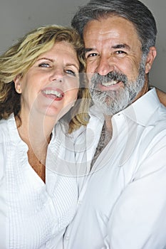 Mature couple together embracing smiling photo