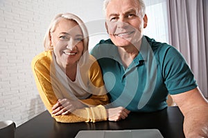 Mature couple using video chat, view from web camera