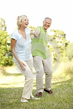 Mature couple walking in countryside