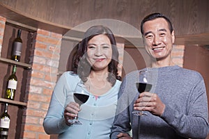 Mature Couple at a Winetasting photo