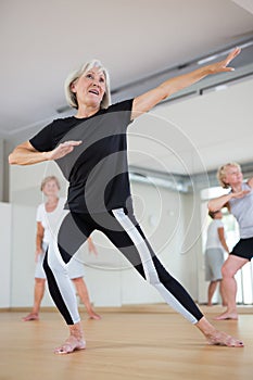 Mature dancing woman practices energetic swing