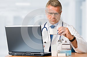 Mature doctor check some medicines