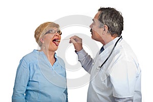 Mature doctor examine sore throat