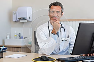 Mature doctor at office
