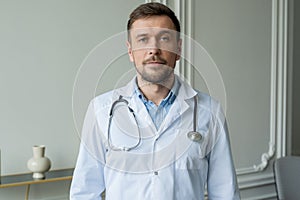 Mature doctor posing and smiling at camera, concept healthcare and medicine