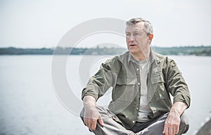 Senior man, outdoor portrait sad  mood, lifestyle