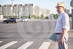 Mature european man waiting to cross street