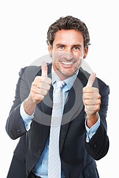Mature executive giving thumbs up. Portrait of handsome business man giving thumbs up against white background.