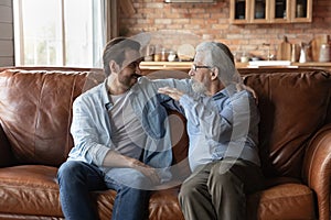 Mature father enjoy weekend talking with grownup son