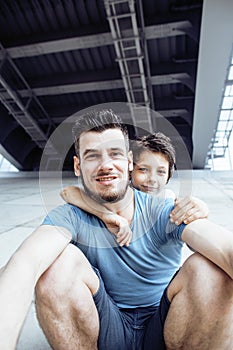 Mature father with his son under the bridge having fun together happy family, lifestyle people concept